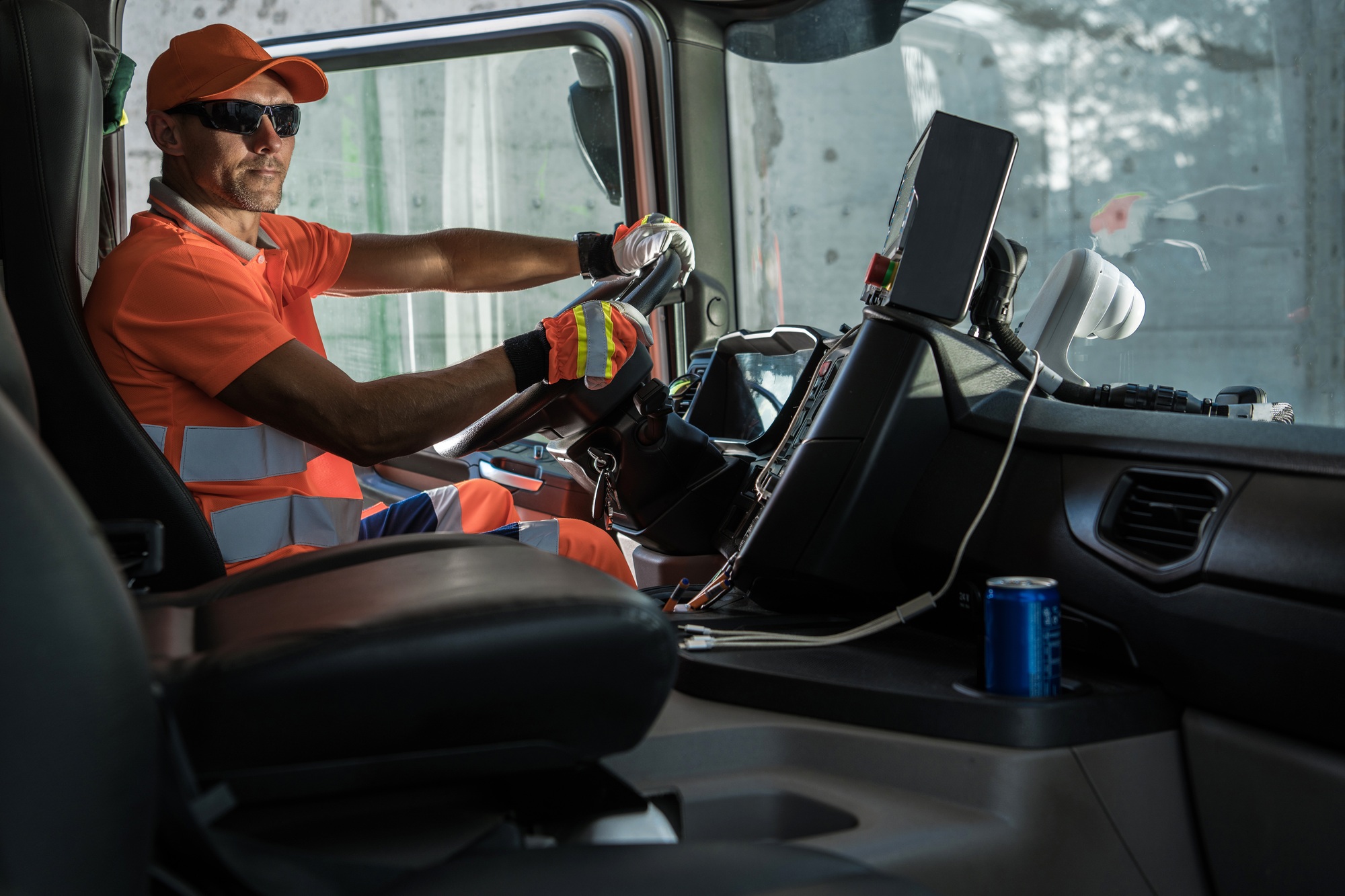 Caucasian Garbage Truck Driver Behind the Wheel
