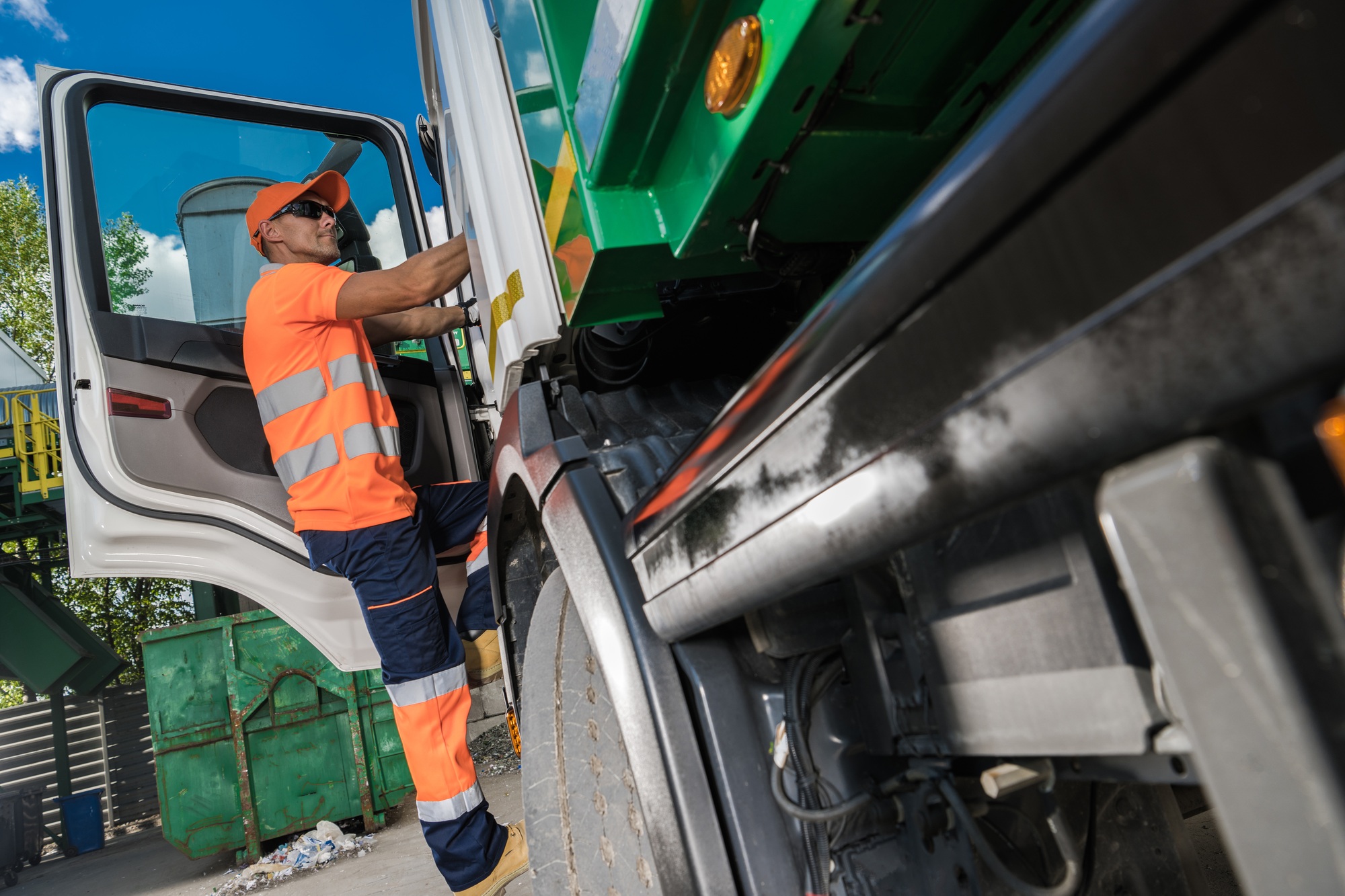 Garbage Truck Driver and City Garbage Collecting