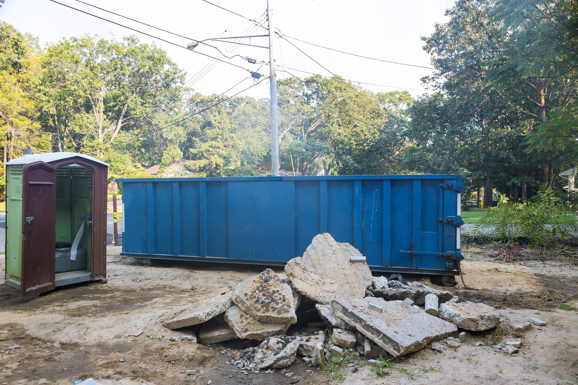 Removal of debris construction waste building demolition with rock and concrete rubble on portable